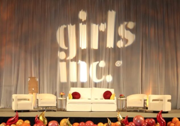 5 women in red dresses at the Girls Inc. 2019 Luncheon